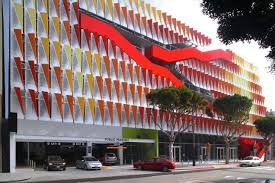 Modern parking garage by kingleno a modern garage with a metal facade, glass entrance, and colorful signs. Pin On Arts Culture