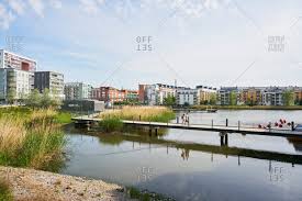 Walking pathway in hammarby sjostad, modern buildings and trees. Hammarby Sjostad Stock Photos Offset