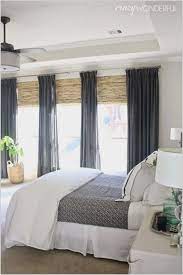 This is a guest master bedroom with a modern loft feel with a touch of humor acknowledging its mountain location. Bedroom Between Window Ideas Gray Master Bedroom Window Treatments Bedroom Window Coverings Bedroom