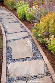 Most landscaping retailers sell a variety of crushed rocks classified by rock size. 27 Easy And Cheap Walkway Ideas For Your Garden Walkway Landscaping Front Yard Landscaping Garden Walkway