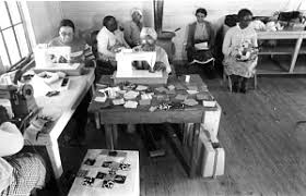 Black and white photograph of unidentified women from the PPC sewing patchwork animals
