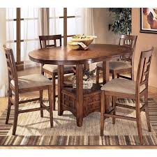 Is a furniture manufacturing company headquartered in arcadia, wisconsin. Cross Island Counter Height Dining Room Set Signature Design By Ashley Furniturepick