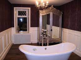 Arguably, marble paneling works best when fitted to half the length of a bathroom wall. Lovely Slipper Bath And Dark Walls And Amazing Armoire Bathroom Wall Panels Bathroom Wall Coverings Waterproof Bathroom Wall Panels