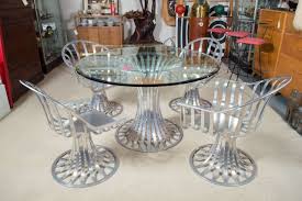 Woodard furniture's master craftsmen have been creating luxury outdoor furniture for over 150 years. Russell Woodard Aluminum Patio Furniture Table And Two Chairs At 1stdibs