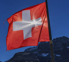 Swiss flag colors, history and symbolism of the national flag of switzerland. Switzerland Flag Switzerland Suisse Flag Patriotism Sky Mountain Environment Wind Nature Pxfuel