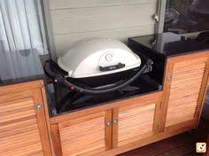 By combining a bar counter and chairs with the grilling station, everyone can visit while the food is sizzling. 12 Built In Weber Q Ideas Outdoor Kitchen Outdoor Kitchen Design Built In Grill