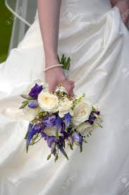 Cascading wedding calla lily bouquet purple bouquet bridal bouquet real touch purple calla lily bridal bouquet wedding bouquets. Bride Holding A Purple And White Wedding Bouquet Stock Photo Picture And Royalty Free Image Image 28719329
