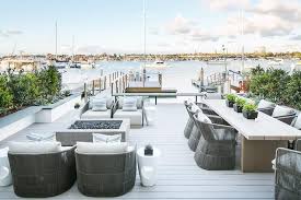 Seafront Deck Is Warmed With A Restoration Hardware Ixtapa Square Fire Table Flanked By Restoration Hardwa Beach House Decor Patio Restoration Hardware Outdoor
