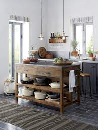 Like A Treasured Vintage Find Or A Custom Designed Piece This Elegant Kitchen Island Serves As A Rustic Y Elegant Kitchen Island Kitchen Design Rustic Kitchen