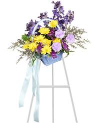 To modify or track your open order, please verify the recipient's last name and the order confirmation number which can be found in your confirmation email. Blessed Blue Spray Funeral Arrangement Flower Shop Network