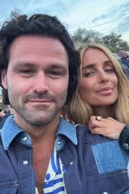 Louise Redknapp snogs boyfriend at Glastonbury as she finally moves