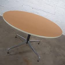 This fresh new take on the classic farmhouse design is constructed from solid mahogany in a rich brown. Eames Herman Miller Round Table Universal Base Wood Grain Laminate Top For Sale At 1stdibs
