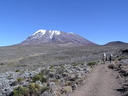 The two summits are connected by a saddle that lies at about 14,500 feet. Kilimanjaro Uhuru Peak