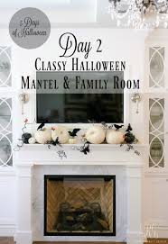 A look at my spooky halloween mantel using crooked pictures, pumpkins, halloween hats, spiders and more! 5 Days Of Halloween Day 2 Classy Halloween Mantel And Family Room