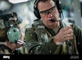 U.S. Air Force Maj. Corey Norton (right) and Capt. Danielle Cooper, both  flight nurses, with the 43rd Aeromedical Evacuation Squadron, Pope Army  Airfield, N.C., discuss patient care while in-flight aboard a C-17