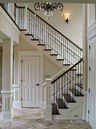 Staircase with iron spindles and gray herringbone. Pin On Interior Furniture