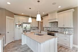 Kitchen With White Cabinets And White Island Kitchen Cabinets Grey And White Kitchen Decor Grey Grey Kitchens
