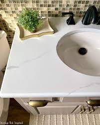 This blogger did and made it look like faux marble! How To Paint A Countertop To Look Like Marble Average But Inspired