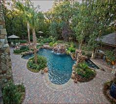 Developing backyard landscaping ideas can seem like a big project, but coming up with great long, narrow backyards look larger than they really are if you capture some sky in a reflecting pool or pond. Swimming Pool Backyard Having A Pool Surrounded By Trees Would Certainly Give Some Mo Pool Landscape Design Landscaping Around Pool Backyard Pool Landscaping