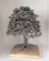 It's impossible to say when the art of sculpting with wire came about, since humankind has always made items out of the wire they drew from the ores. Artist Makes Intricate Tree Sculptures By Twisting Single Strands Of Wire Wire Tree Sculpture Metal Tree Tree Sculpture
