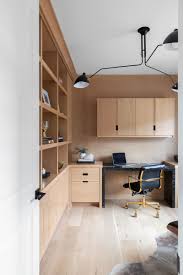 In the photo above, a narrow area of paneling surrounded by white walls actually helps the space look more modern. 20 Gorgeous Ways To Make Wood Paneling Feel Modern