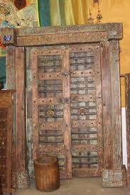 An Old Door Long Sideboard Chest Is Used As A Media Console And Gives Added Storage Connecting To The Roots And An Infusio Teak Wood Rustic Pots Antique Doors