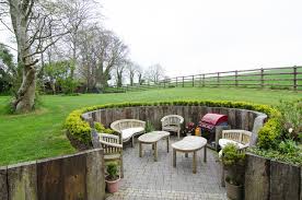 Decorated appropriate and with corten steel, found a convenient storage area for fire wood. 10 Sunken Seating Areas Bring Drama To Decks And Patios