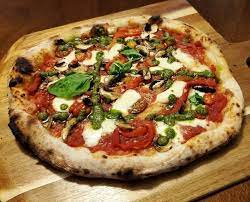 Homemade Veggie Pizza In The Ooni Pro Using Wood Finished With Pesto Drizzle On Top Pizza Pizzas Food Foods Veggie Pizza Cooking Recipes
