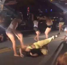 Police are investigating the viral video of a brutal and bloody fight between two women at a camden, n.j. Bikini Clad Women Have A Massive Fist Fight In The Street During Spring Break In Miami