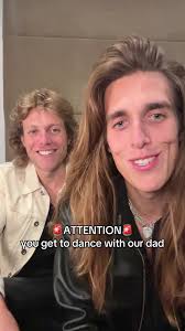 Guy and Dad Moving Hips During Concert