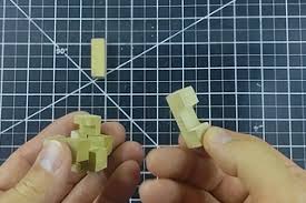 The puzzle consists of three wooden pieces (looks like stained radiata wood), namely an octagonal block attached by a rope to a long cylindrical rod. Make And Solve A 6 Piece Burr Puzzle 10 Steps With Pictures Instructables