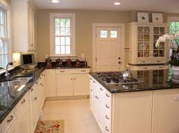 This set of white cabinets with granite countertops will add a classic and classy appeal to your kitchen decor. Brown Kitchens With White Cabinets Kitchen Design Plans White Kitchen Cabinets Kitchen Design