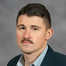 PERI faculty members (from left) Steven Sprick Schuster, Daniel Smith, and  Ennio Piano celebrate PERI Fellow Protik Nandy's suc