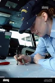 Navy Petty Officer 3rd Class Sarah Eleazer plots the position of the USS  Theodore Roosevelt (CVN 71)