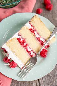 Moist chocolate cake filled with raspberries and chocolate ganache, frosted in whipped ganache and decorated with fresh raspberries and chocolate shards. White Chocolate Raspberry Cake Liv For Cake