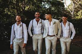 Braces Have Never Looked So Good This Groom And His Groomsmen Are Looking Fine In Their Cris Beach Wedding Attire Beach Wedding Groom Wedding Groomsmen Attire
