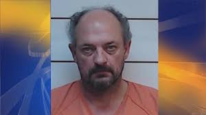 Man charged in death of wife, whose skull was found property