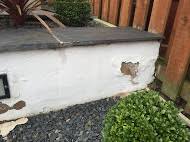 Another option for blocking a neighbor's ugly wall from view is to use planters and other containers to create a garden in front of the eyesore. How Can I Waterproof Garden Walls Which Have Bad Damage To The Rendering Gardening Landscaping Stack Exchange