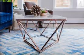 Up top, the square tabletop is made from stone with a white marble veneer. Aria White Marble Coffee Table Geometric Rose Gold Edloe Finch Furniture Co