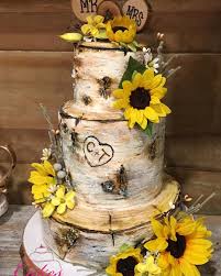 Birch Tree Wedding Cake With Sunflowers This Birch Bark Cake Makes It Debut At A 4th Of July Wedding Cakesbyrobbin Weddingcak Sunflower Themed Wedding Country Wedding Cakes Sunflower Wedding Cake