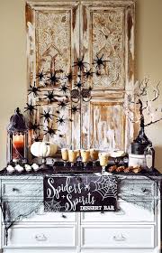 8 Bewitching Table Ideas For Your Halloween Bash Halloween Party Table Halloween Table Decorations Halloween Tablescape