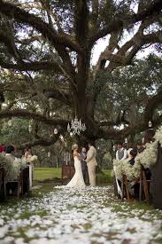 Beautiful Old Tree With A Chandelier Hanging From Its Branch To Create An Altar For An Outdoor Southern Weddi Outdoor Wedding Oak Tree Wedding Backyard Wedding