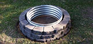 The easiest way to mark the dimensions for the pit, benches and the garden area is to work outward from the center point of the firepit using a stake and a string. My Fire Pit Build Project Using Retaining Wall Blocks Galvanised Rim Self Sufficient Culture