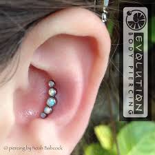 Fresh Conch Piercing With Opal And Titanium Jewelry By Anatometal At Evolution Piercing Body Jewelry Piercing Ear Jewelry Piercings