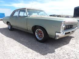 And the new pontiac gto is a distant cousin of the old gto, adopted and twice removed. 1967 Pontiac Tempest 4 Door Sedan