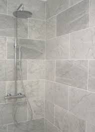 Whilst most people will add a mirror into their space above the vanity unit, adding mirrors to an entire wall will reflect light and pattern in a superb way, making your bathroom look bright and. Image Result For Large Tiled Shower Grey And White Tile Bathroom Small Grey Bathrooms Bathroom Shower Tile