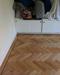Oak Parquet Wood Flooring Fitted In A Herringbone Design With A Single Border And A Darker Wenge Tramline Wood Parquet Flooring Stairs Cladding Flooring