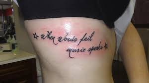 Quote and word rib tattoos for girls. Women Rib Tattoo Quotes Small Quotesgram