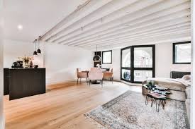 Besides the breakfast bar or dining table that visually separates the two spaces in this tiny apartment, having the ceiling at different heights in the living room and kitchen helps to define the boundary between the spaces. Premium Photo Contemporary Luxury Design Of Living Room With Open Kitchen And Dining Table Near Window