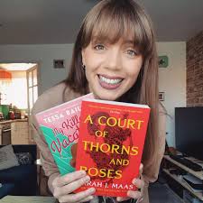 The smile of someone who shouldn't be buying more books, when she has at  least 10